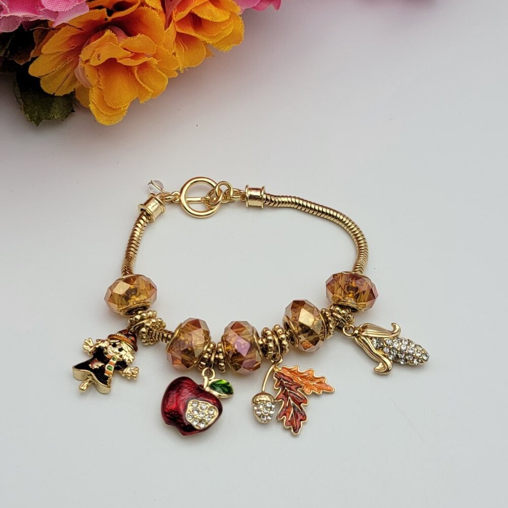 Winter Themed Charm Bracelet Gold Tone Amber Glass Bead Corn Apple Girl Dangle